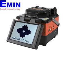 Technician servicing a fiber optic fusion splicer used in optical network installation