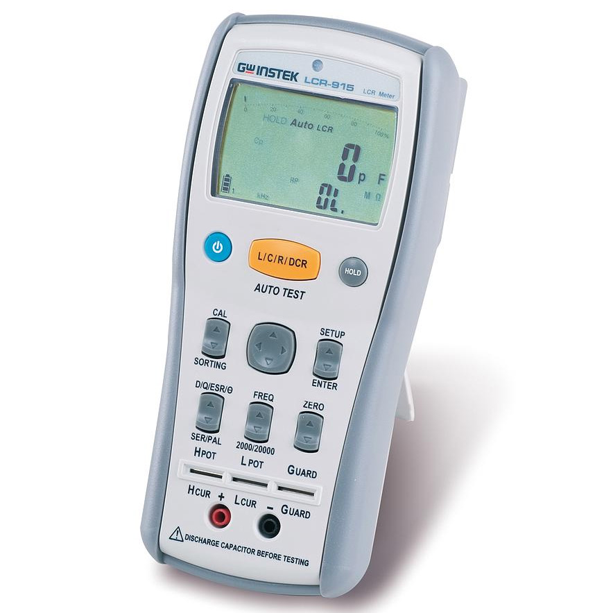 Technician handling an electronic test instrument used for LCR measurement service and repair