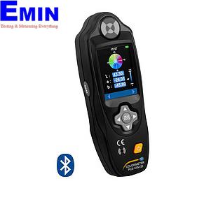 Technician inspecting a color measurement instrument used for industrial quality control